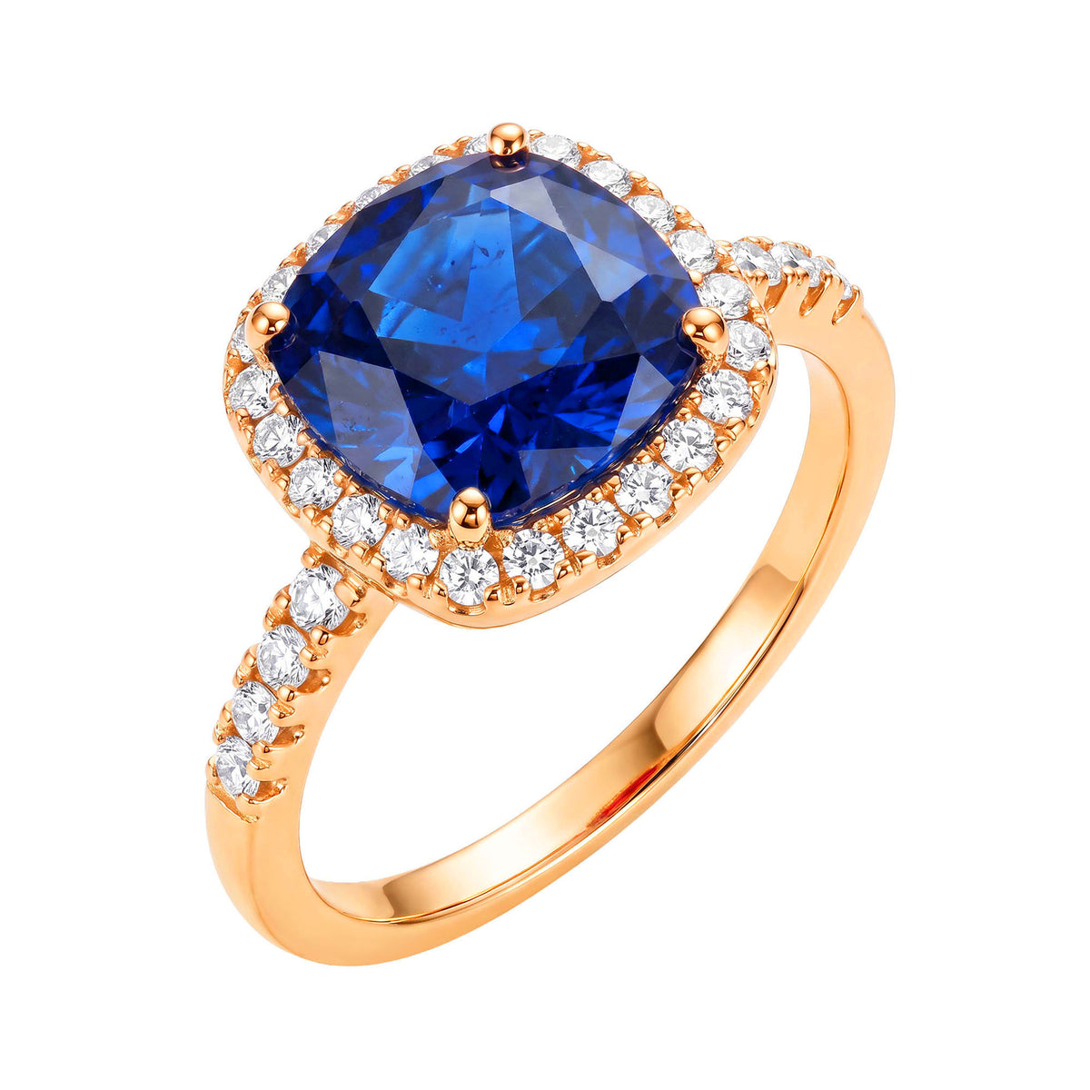 Kullatud sõrmus suure sinise padjakujulise kiviga, valgete tsirkoonide oreooli ja tsirkoonidega kaunistatud kaarega